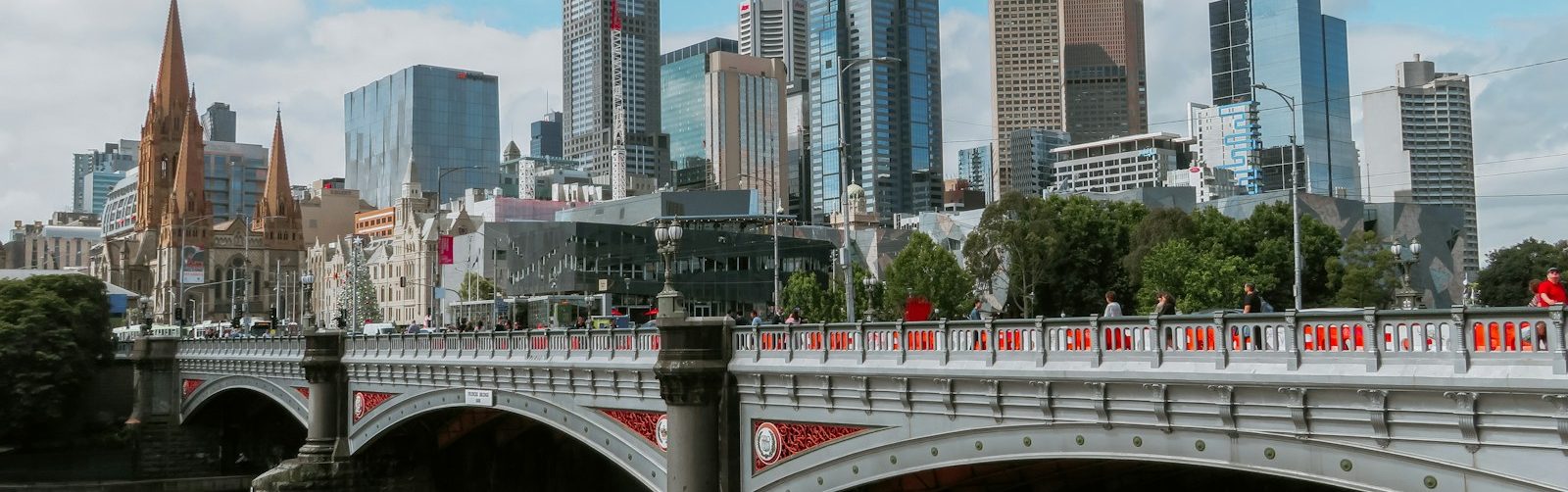 white bridge across city buildings